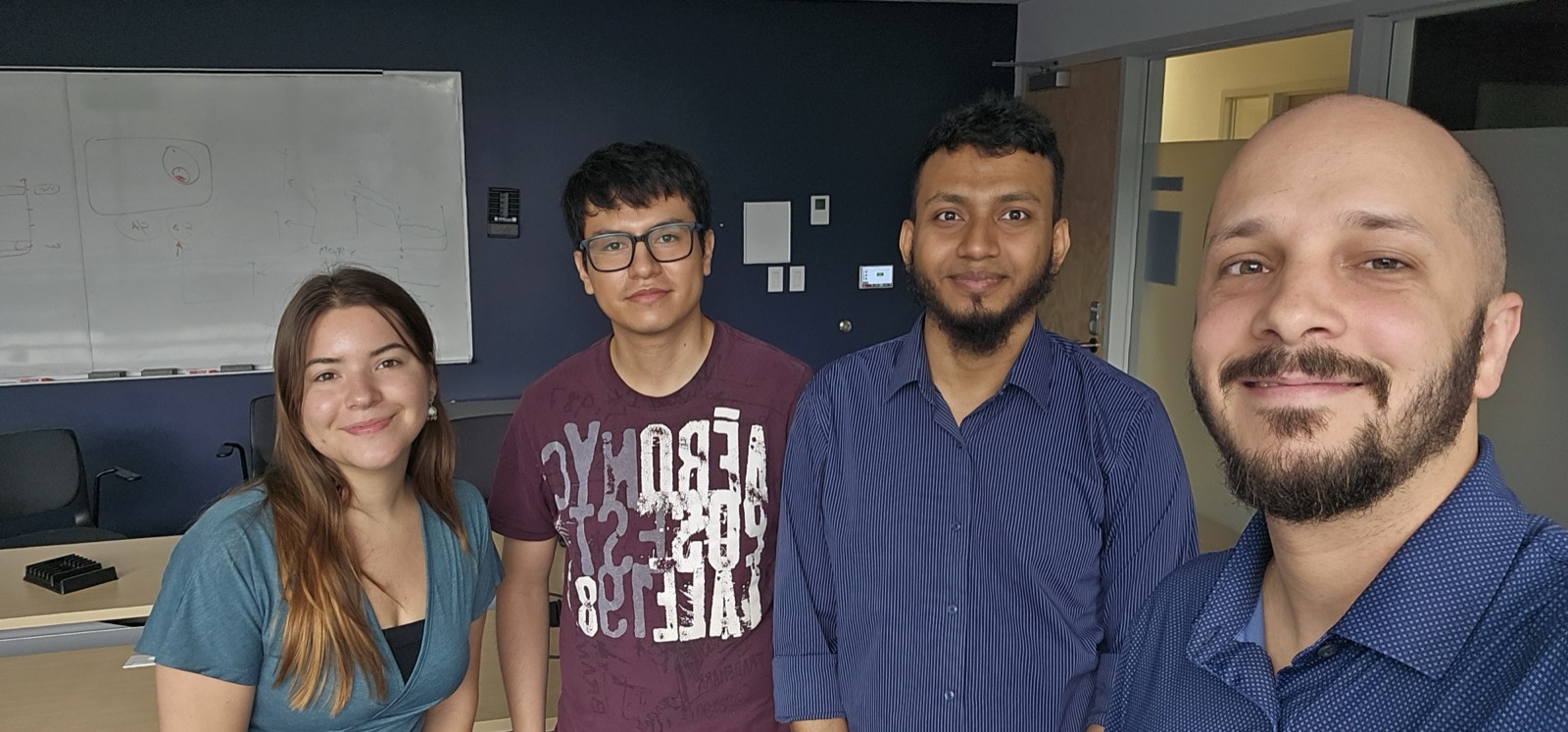 Celebrating with the REALISE Lab after the defense
